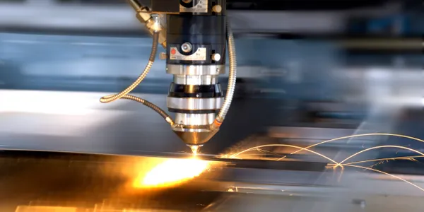 Laser cutting metal with sparks flying